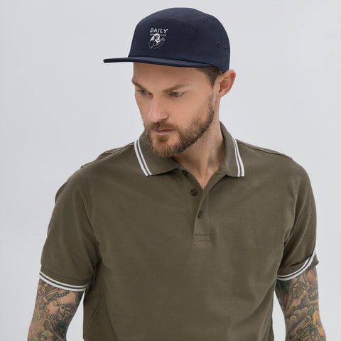 Stylish man wearing a Five Panel Cap with a polo shirt, showcasing streetwear fashion and everyday comfort.