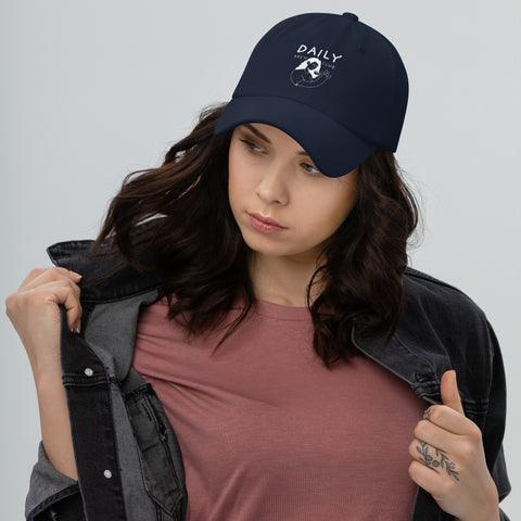 Woman wearing a navy Dad Hat with graphics, styled in casual streetwear for everyday comfort.